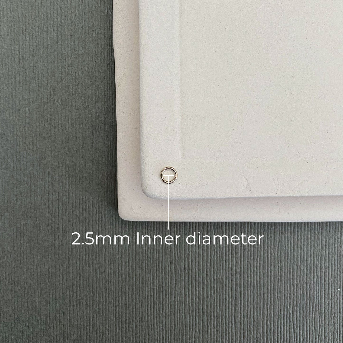 Handcrafted 14k white gold palladium jump ring, 2.5mm, designed for secure jewelry connections.