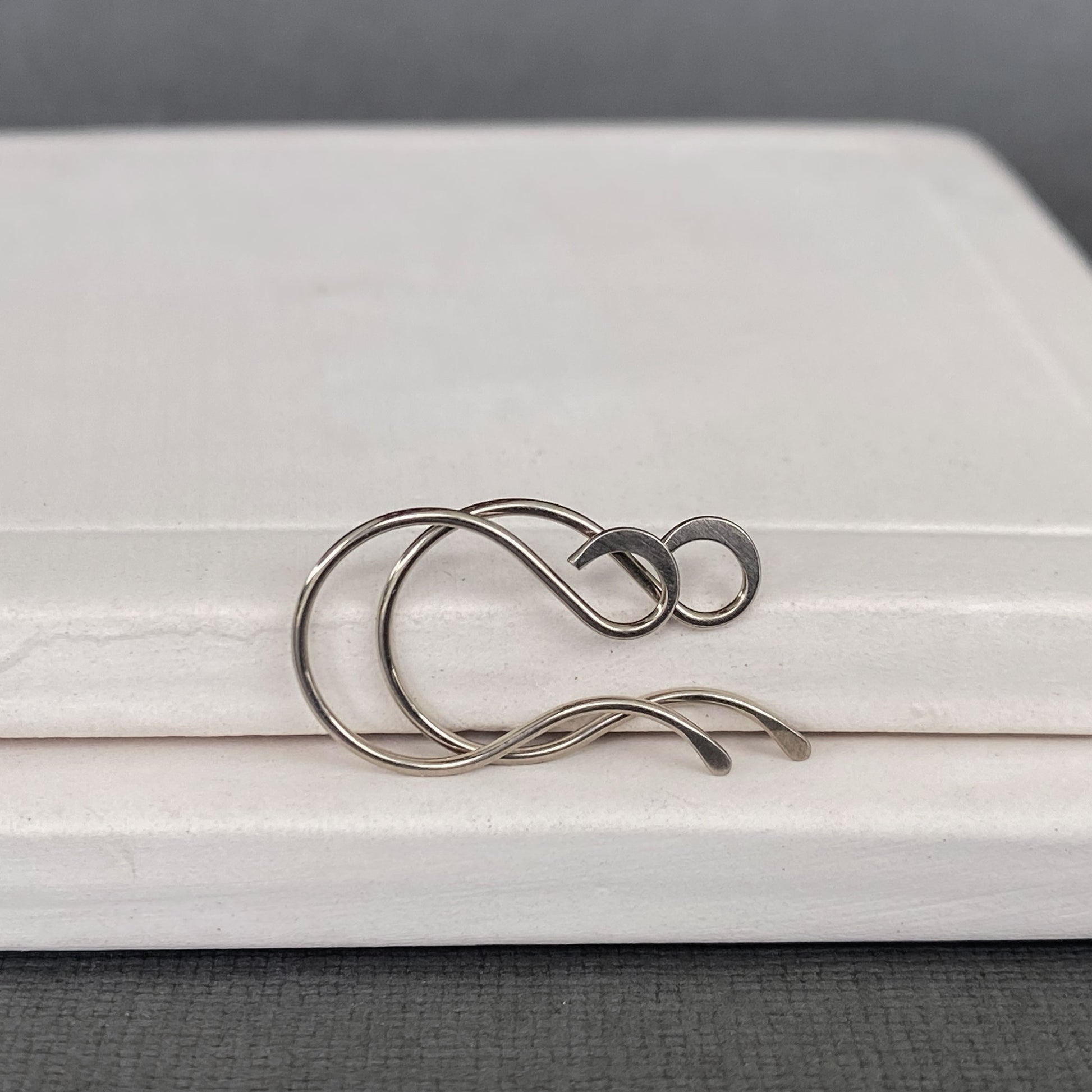 Side view of handcrafted 14k Palladium White Gold ear wires with hammered loops
