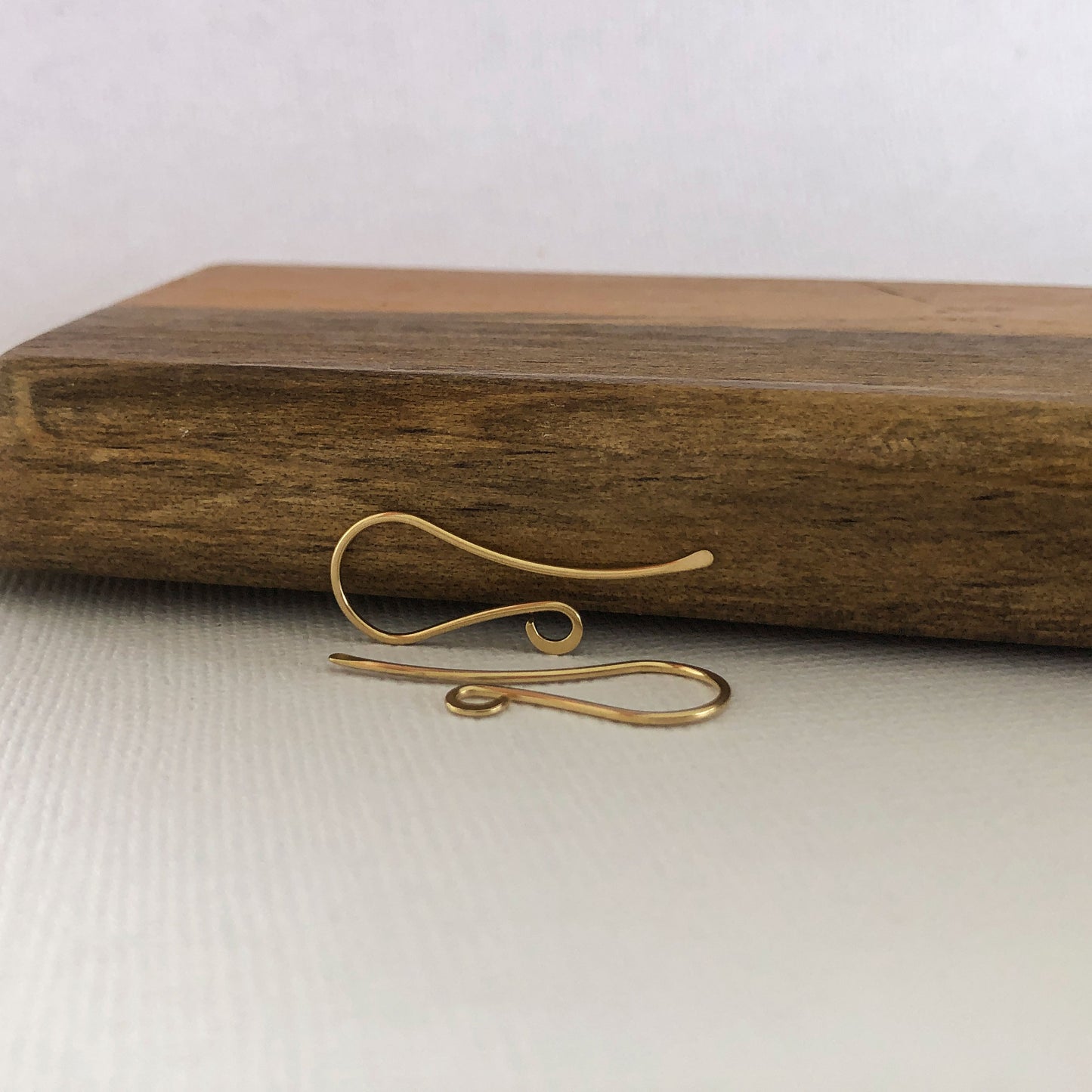 Close-up view of the 18k solid gold shepherd hook ear wire detail.