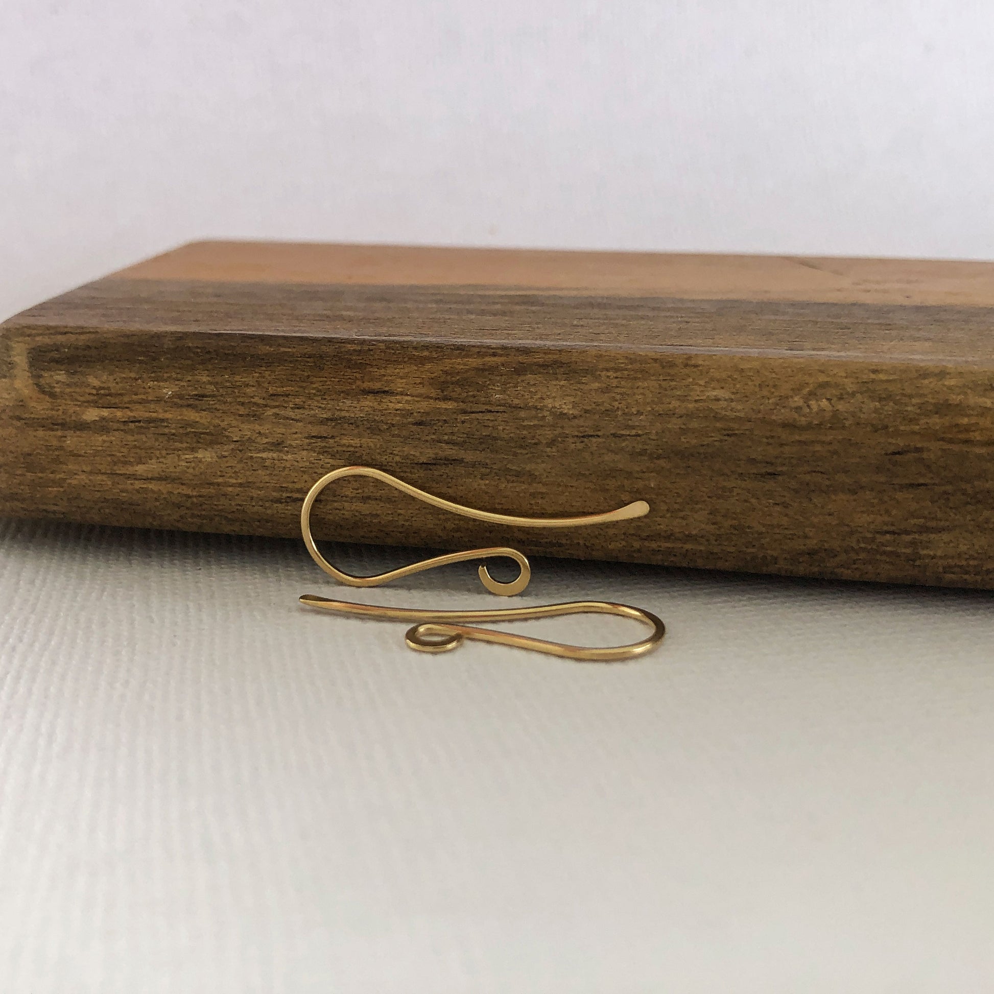 Close-up view of the 18k solid gold shepherd hook ear wire detail.