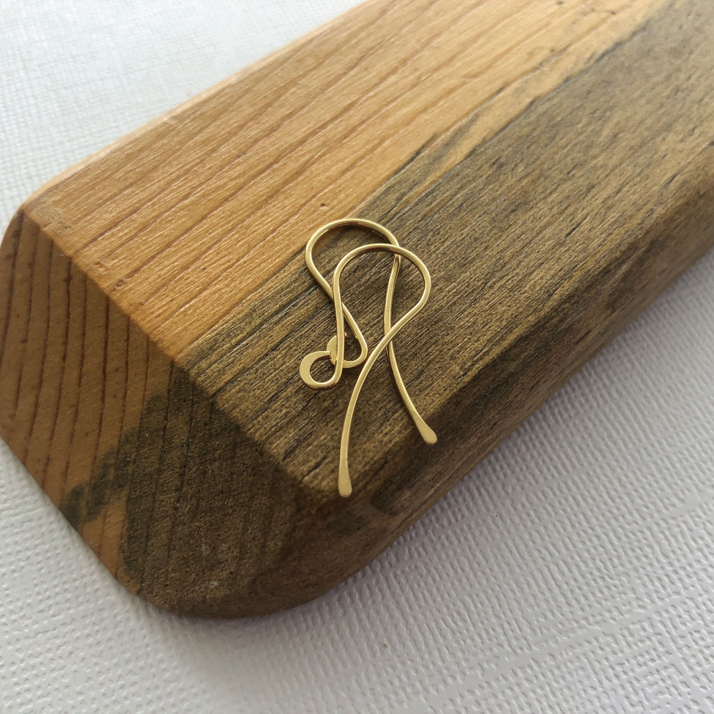 A pair of 18k solid gold shepherd hook ear wires.