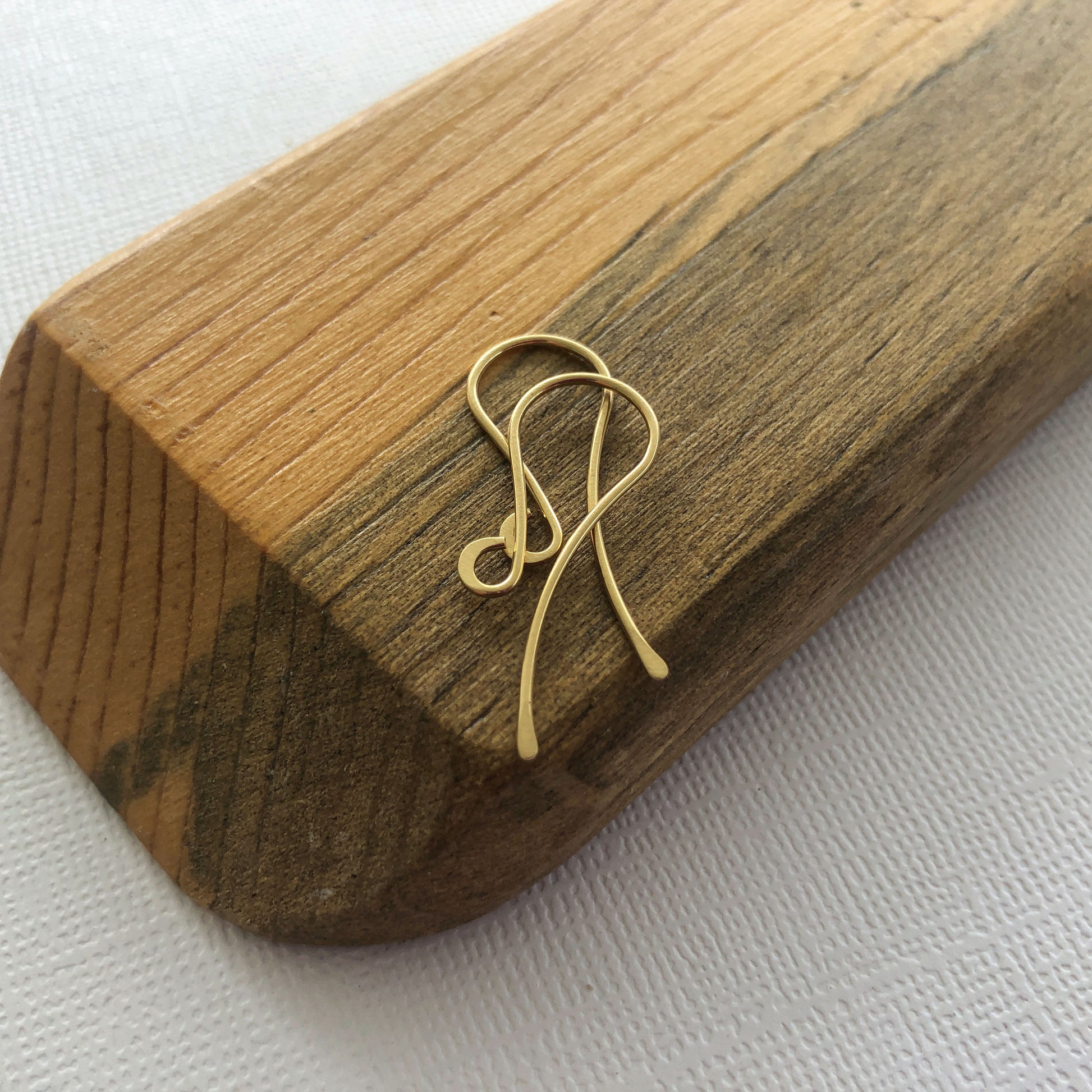 A pair of 18k solid gold shepherd hook ear wires.