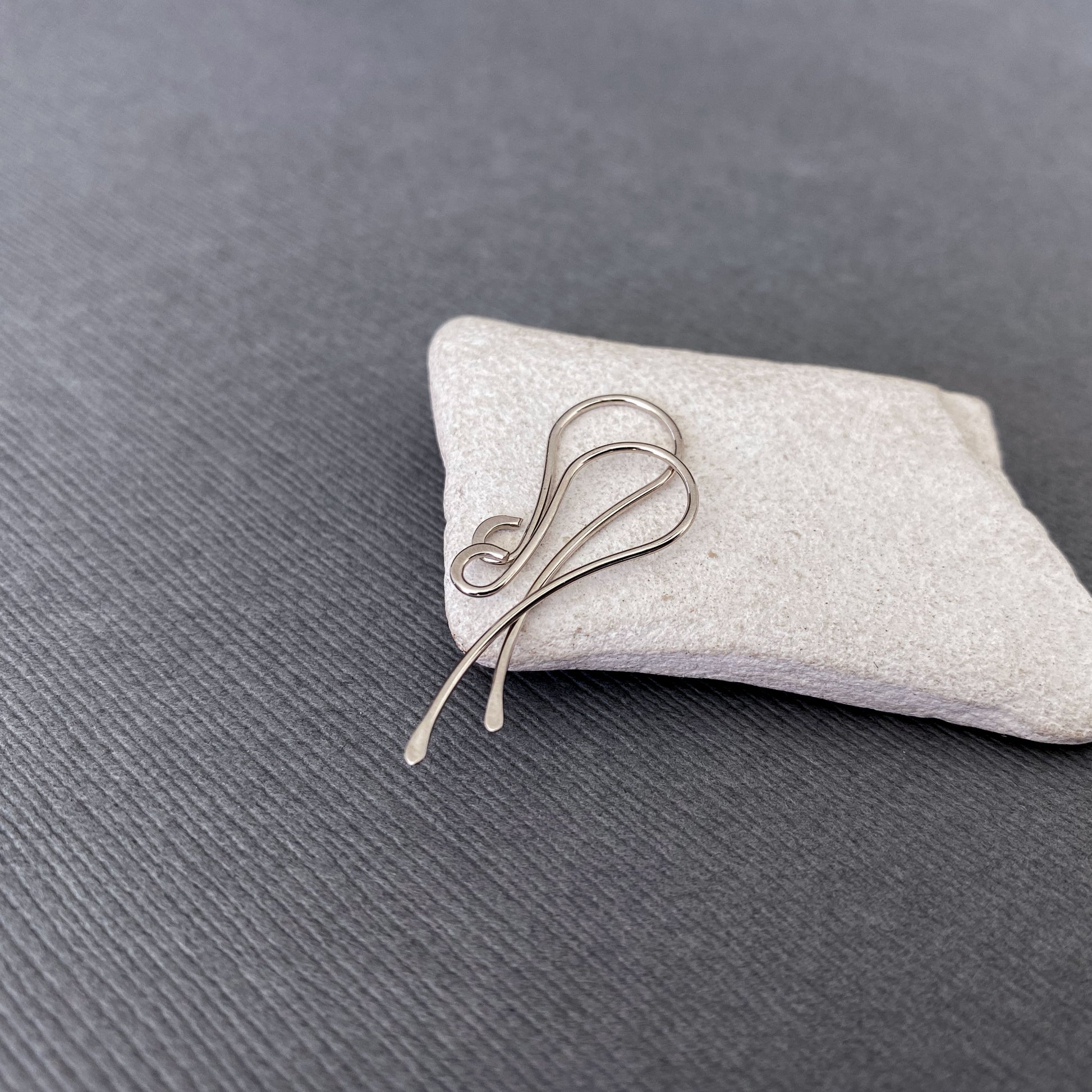 Close-up view of the 14K Palladium White Gold ear wires, highlighting their polished, nickel-free design