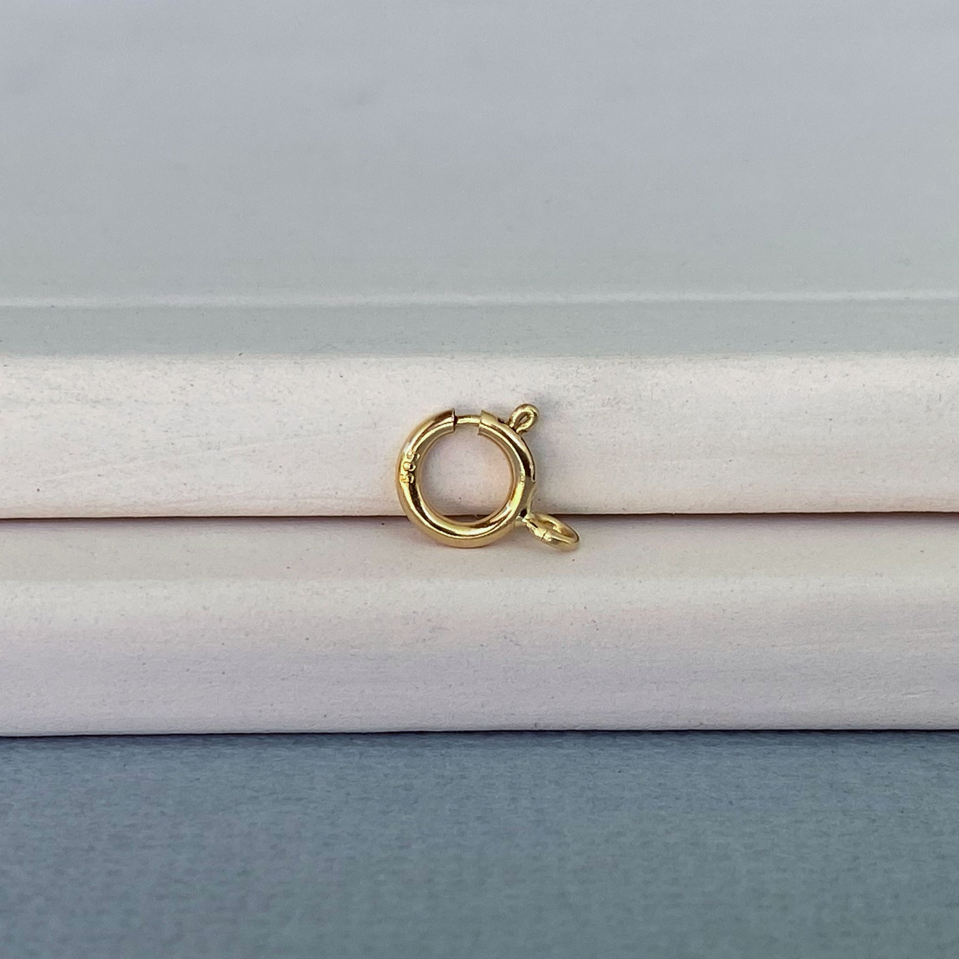 Essential jewelry finding: Italian-made 14k gold spring ring clasp for necklaces and bracelets