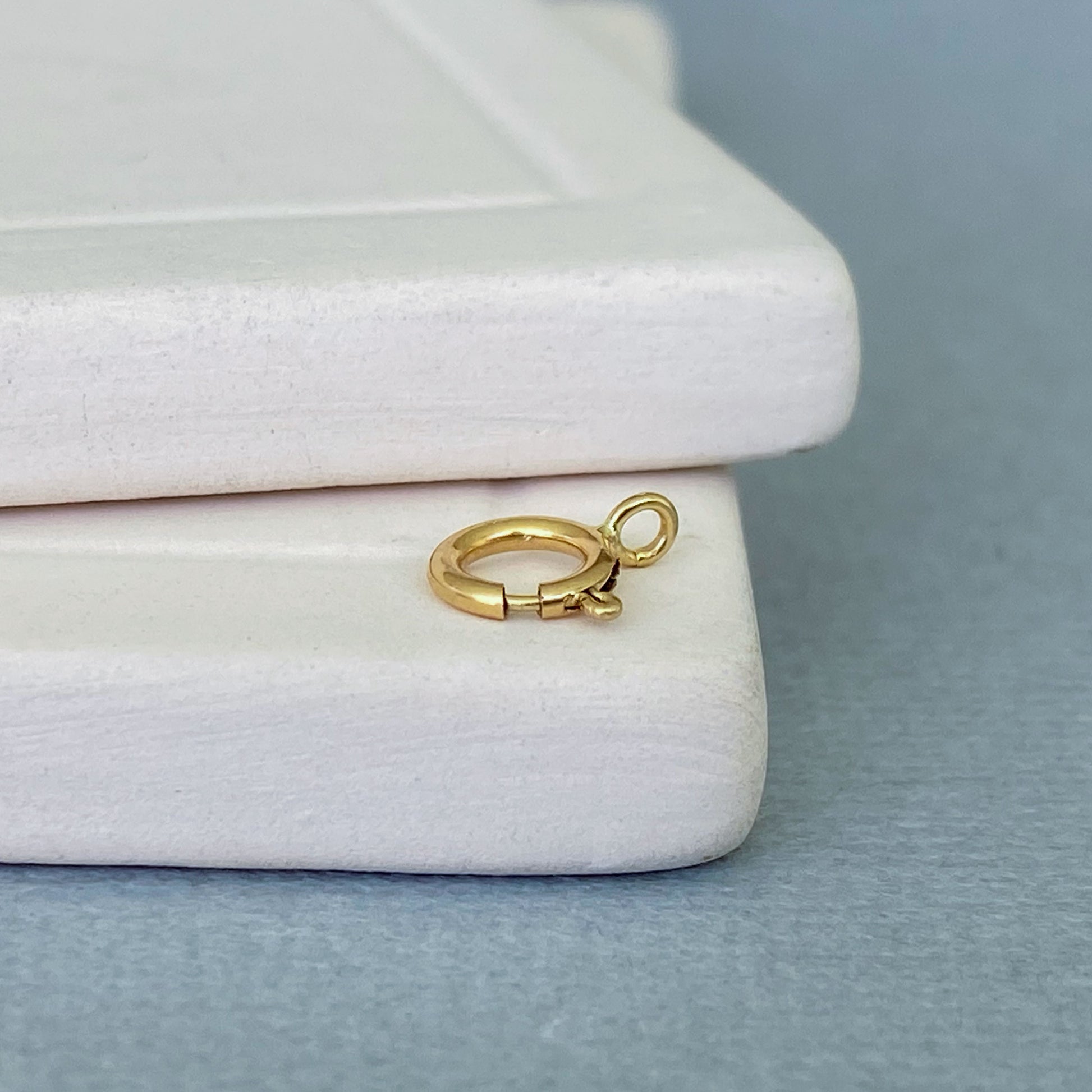Jewelry-making component: 14k yellow gold spring ring clasp with an open ring attachment