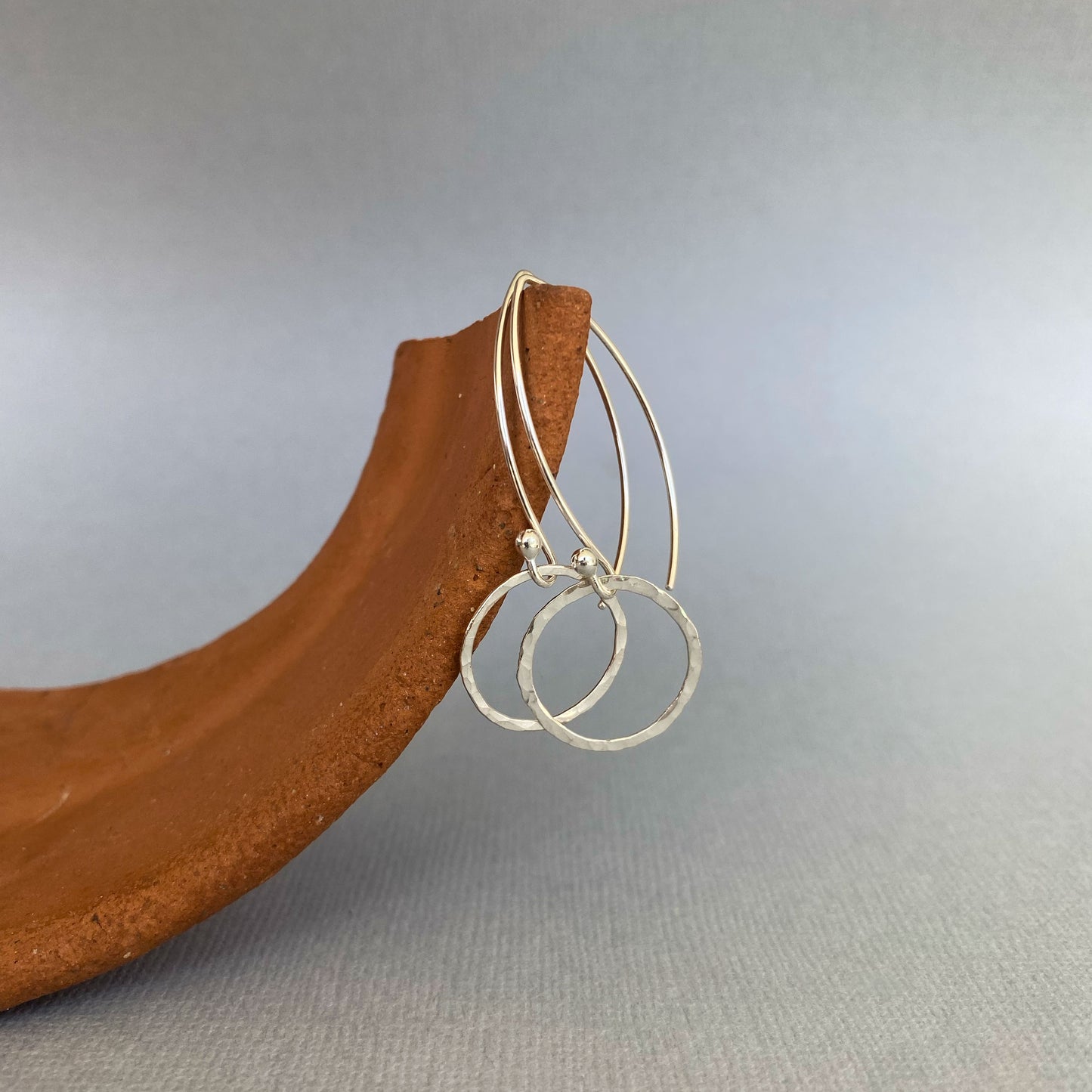 Example of Argentium silver ear wires with a small hoop attached, demonstrating how they look when used in jewelry designs.