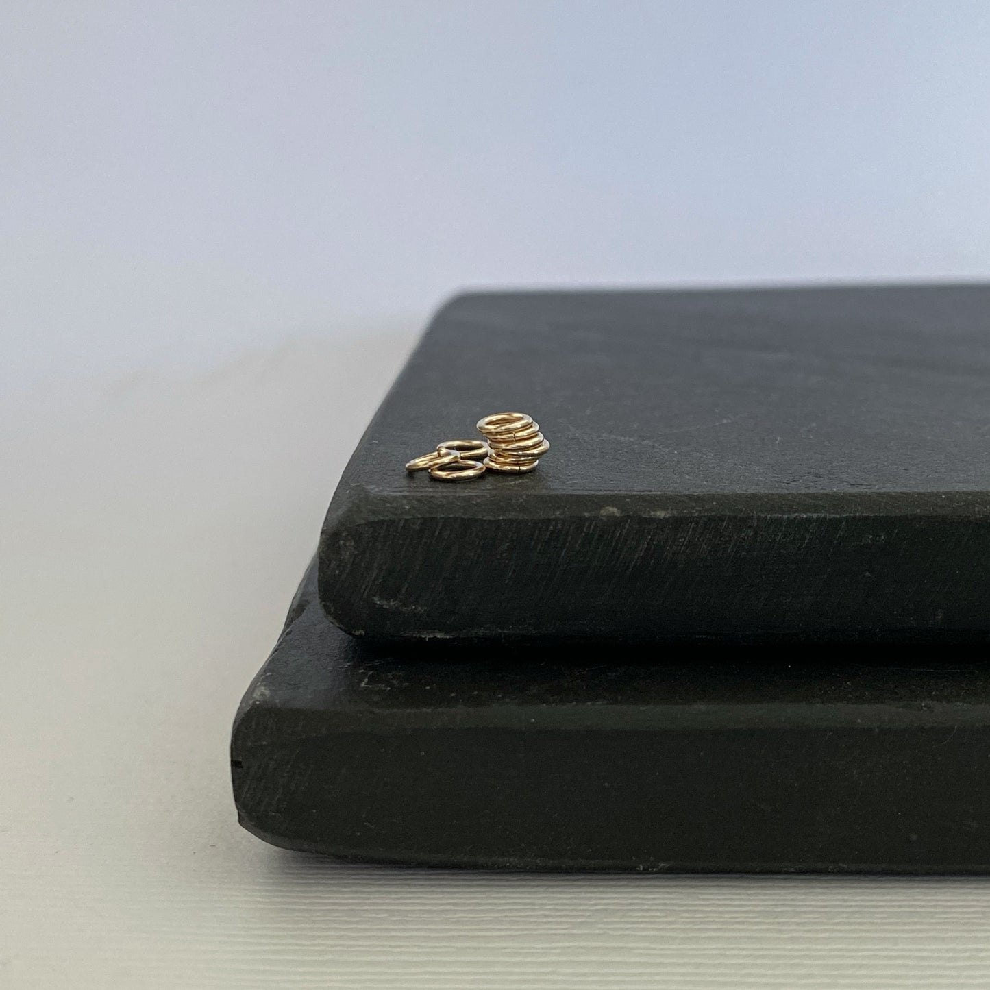 Shiny 2.5mm solid gold jump ring for fine jewelry repairs.