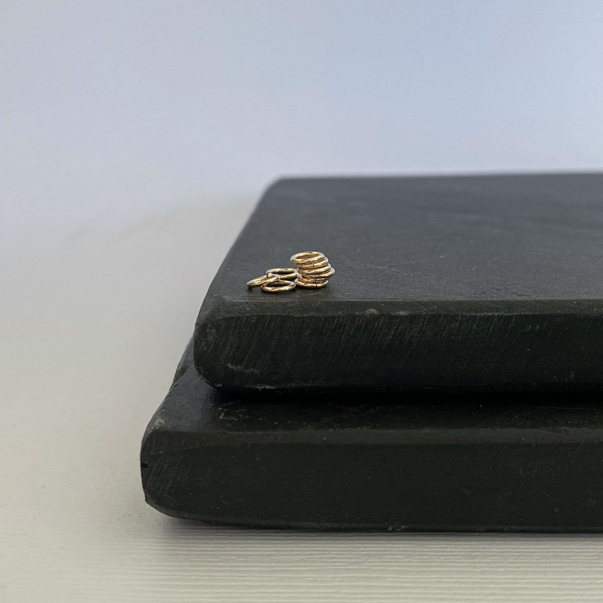 Shiny 2.5mm solid gold jump ring for fine jewelry repairs.