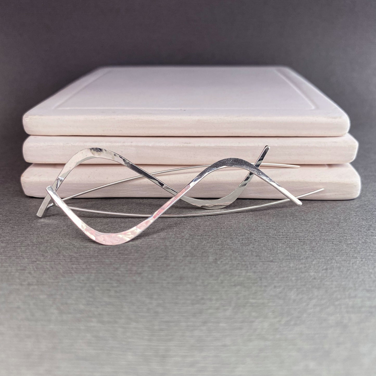 A detailed shot highlighting the craftsmanship and quality of the hypoallergenic sterling silver earrings.