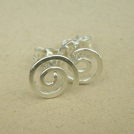 Side view of minimalist sterling silver spiral earrings showing slight hammer texture