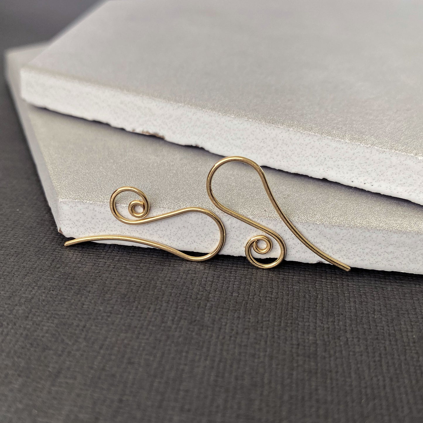 Hypoallergenic 10K solid gold earring hooks, perfect for those with sensitive ears.