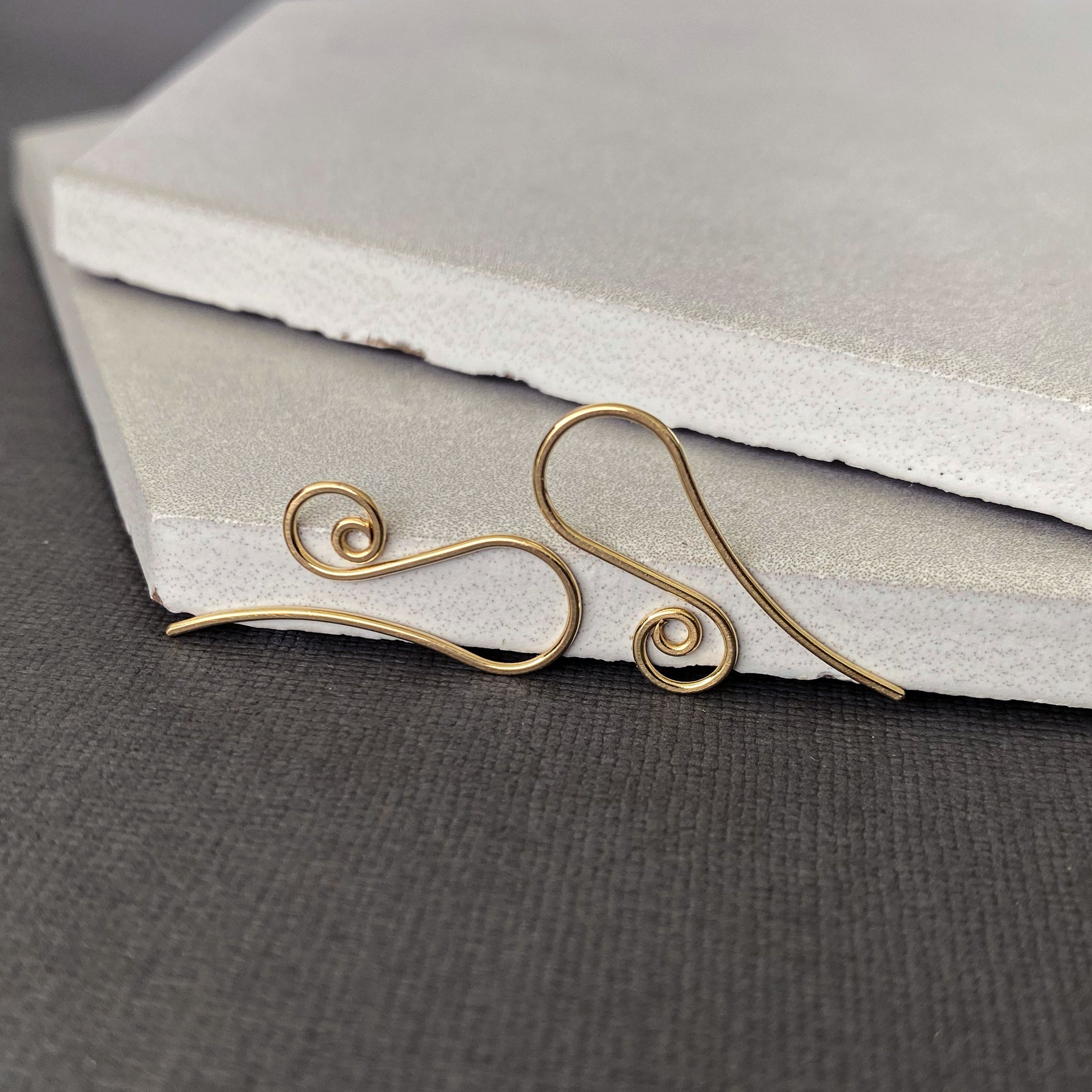 Hypoallergenic 10K solid gold earring hooks, perfect for those with sensitive ears.