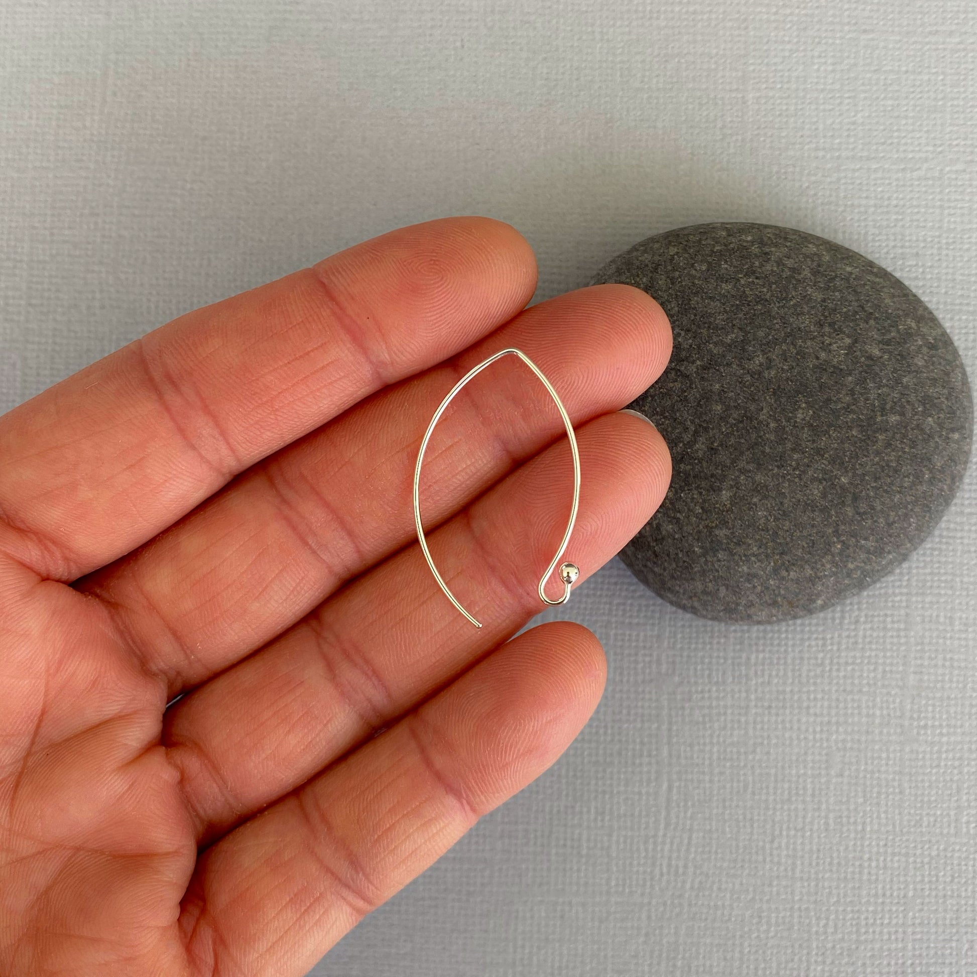Side view of Argentium silver ball-end ear wires, showcasing their sleek, nickel-free design.