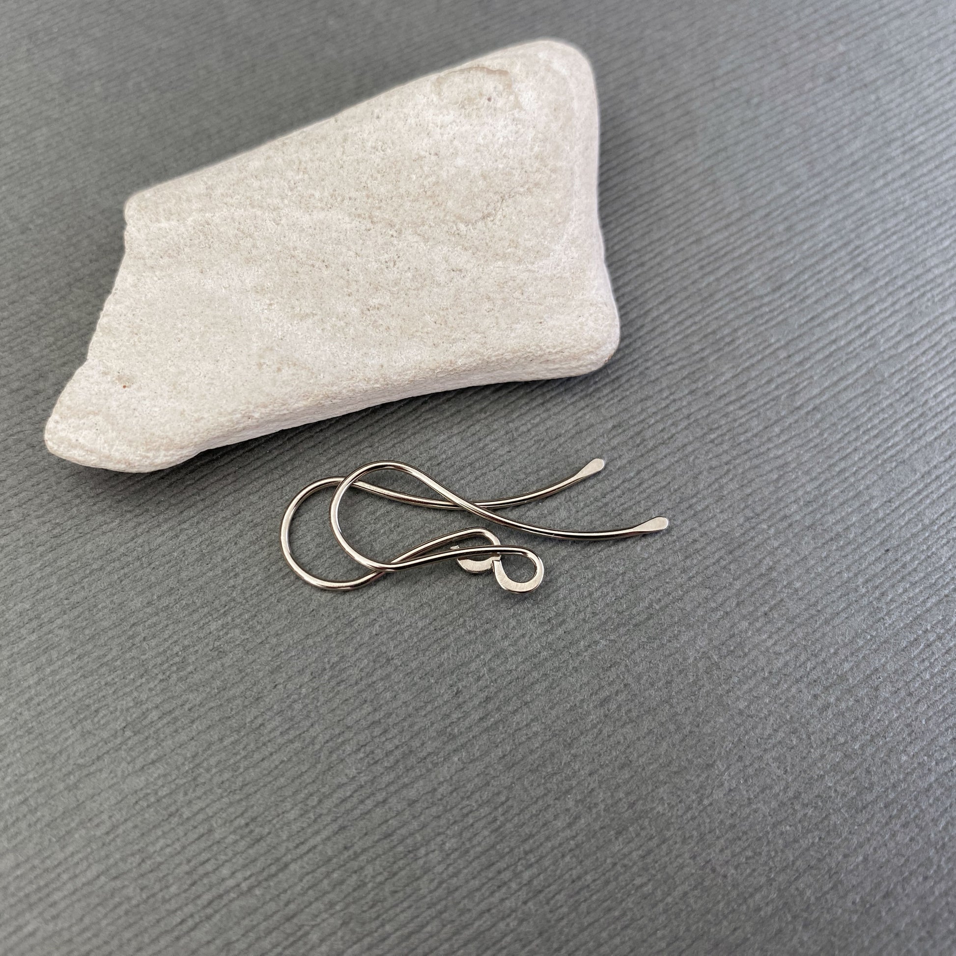 A close-up of the tumbled, polished finish on 14K Palladium White Gold ear wires for added shine and durability.