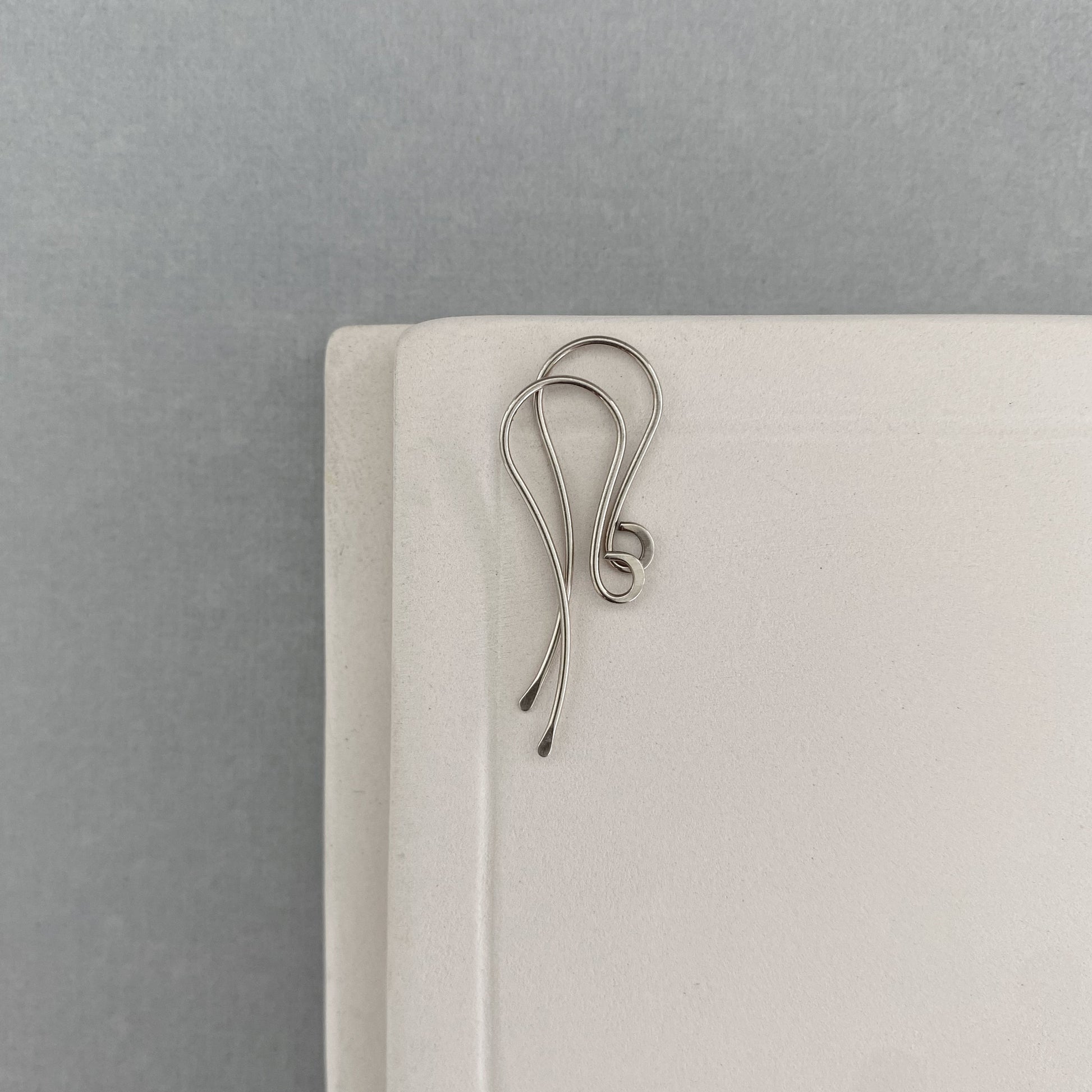 Close-up of premium 14k white gold earring hooks for artisan jewelry