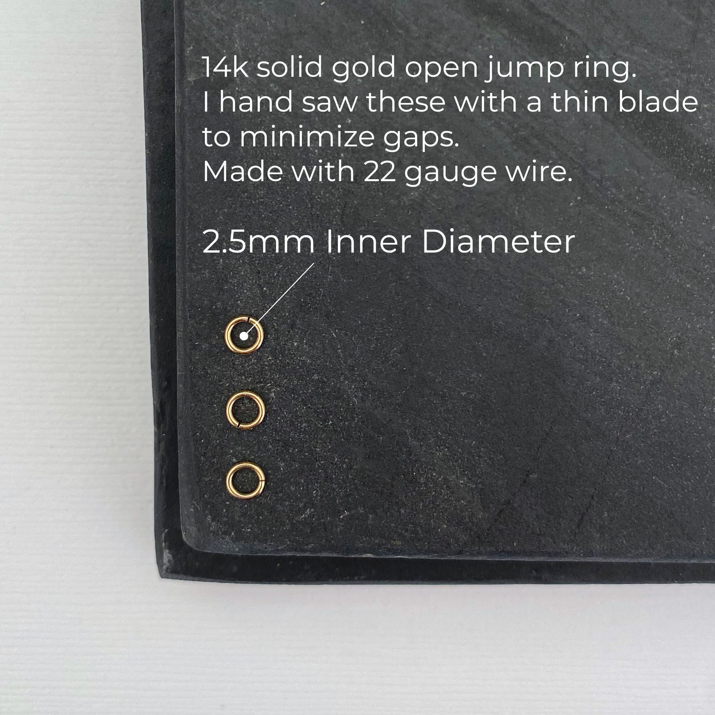 Close-up of a 14K solid gold 2.5mm jump ring, ideal for jewelry making.