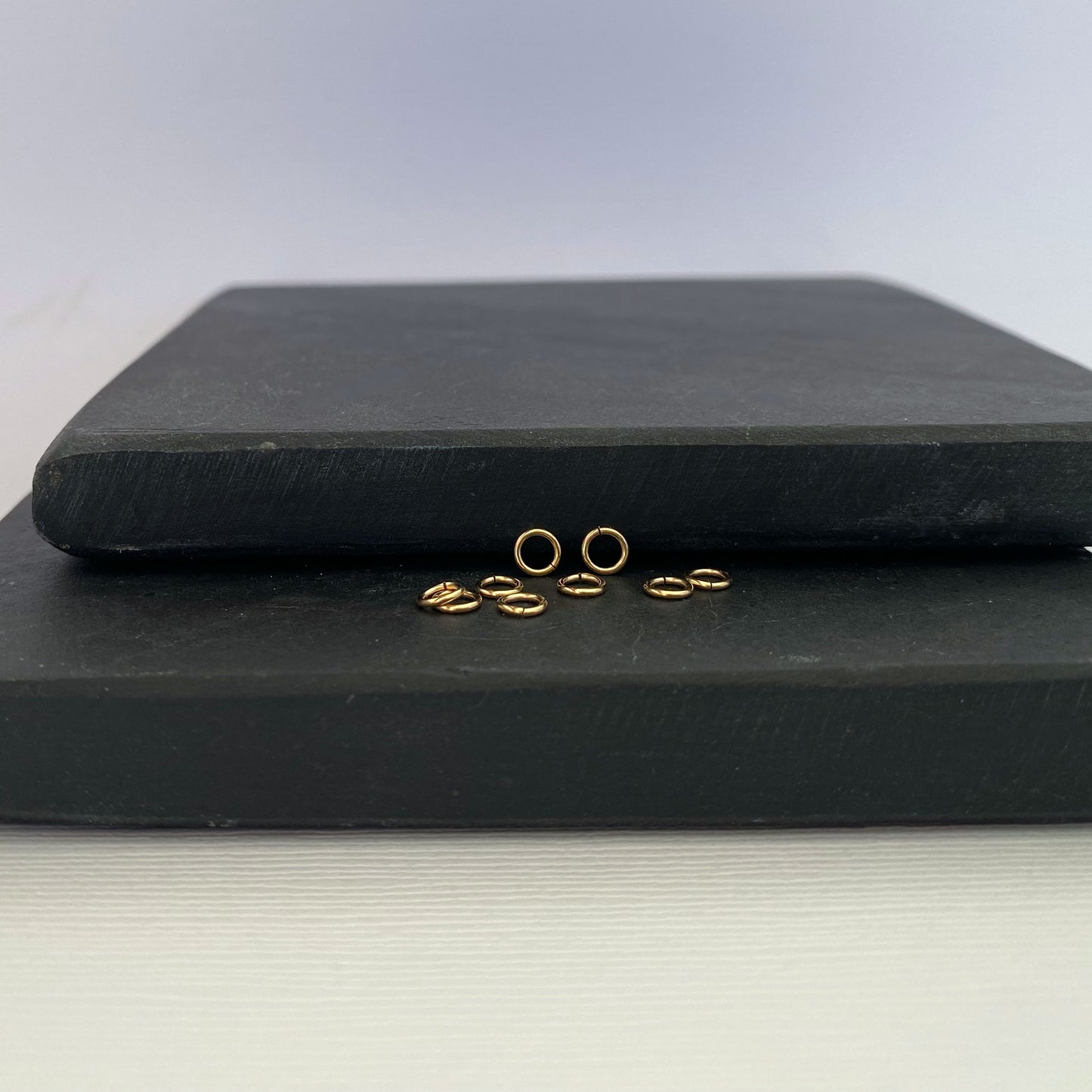 Durable 14K gold jump ring, perfect for attaching charms and clasps.