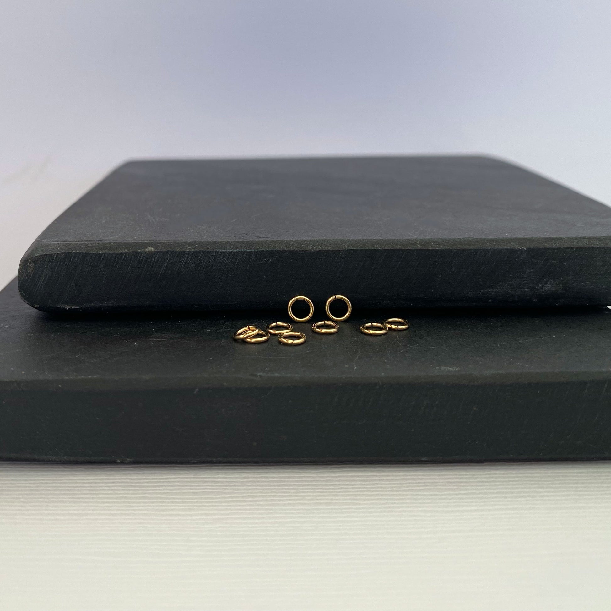 Durable 14K gold jump ring, perfect for attaching charms and clasps.