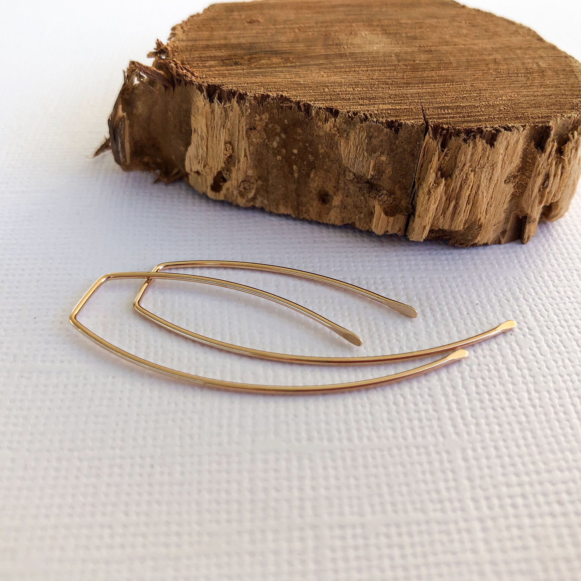 gold filled earring threaders.  They measure just over 1 inch.  the back is longer than the front and both sides have been hammered to give them a unique look
