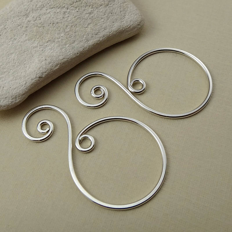 Top-down view of a .925 sterling silver spiral drop charm, crafted for earring or necklace designs.
