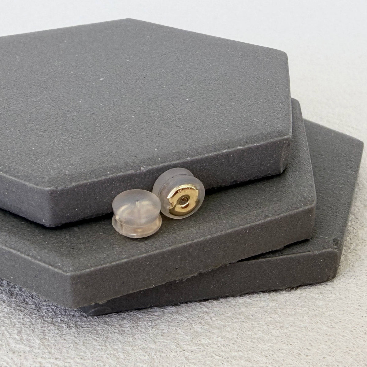 Pair of 14K solid gold silicone earring backs with clear silicone cushions