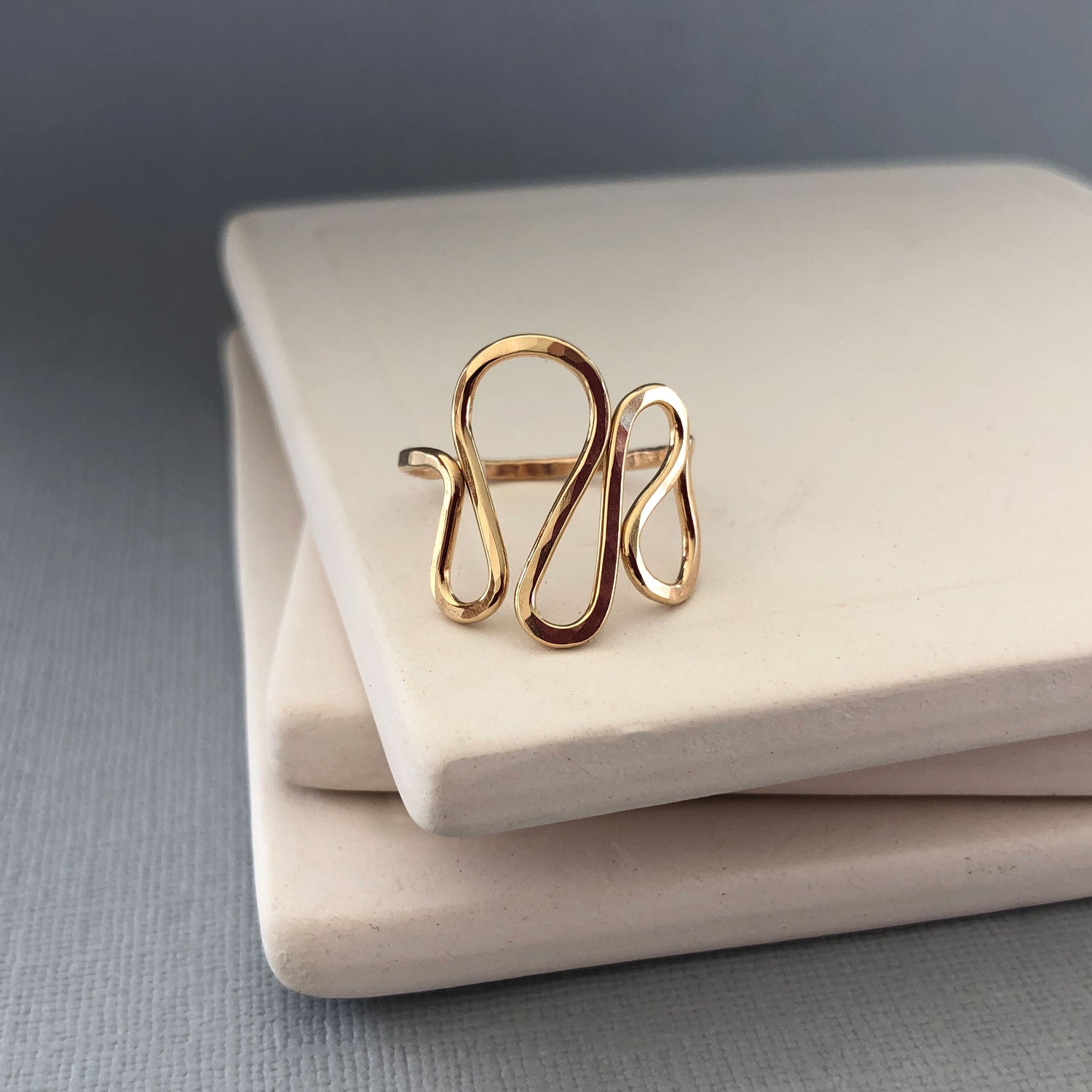 Handmade 14K gold filled wavy ring with a modern, asymmetrical design, slightly adjustable for a comfortable fit—perfect for thumb or statement wear.