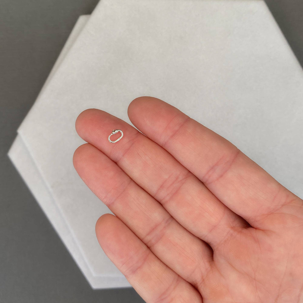 link lock displayed on a finger for size sterling silver