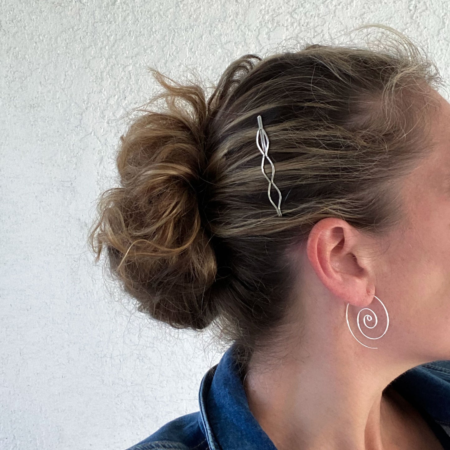 Large spiral hoop earrings.  Handmade, using solid sterling silver wire. Lightly hammered flat.