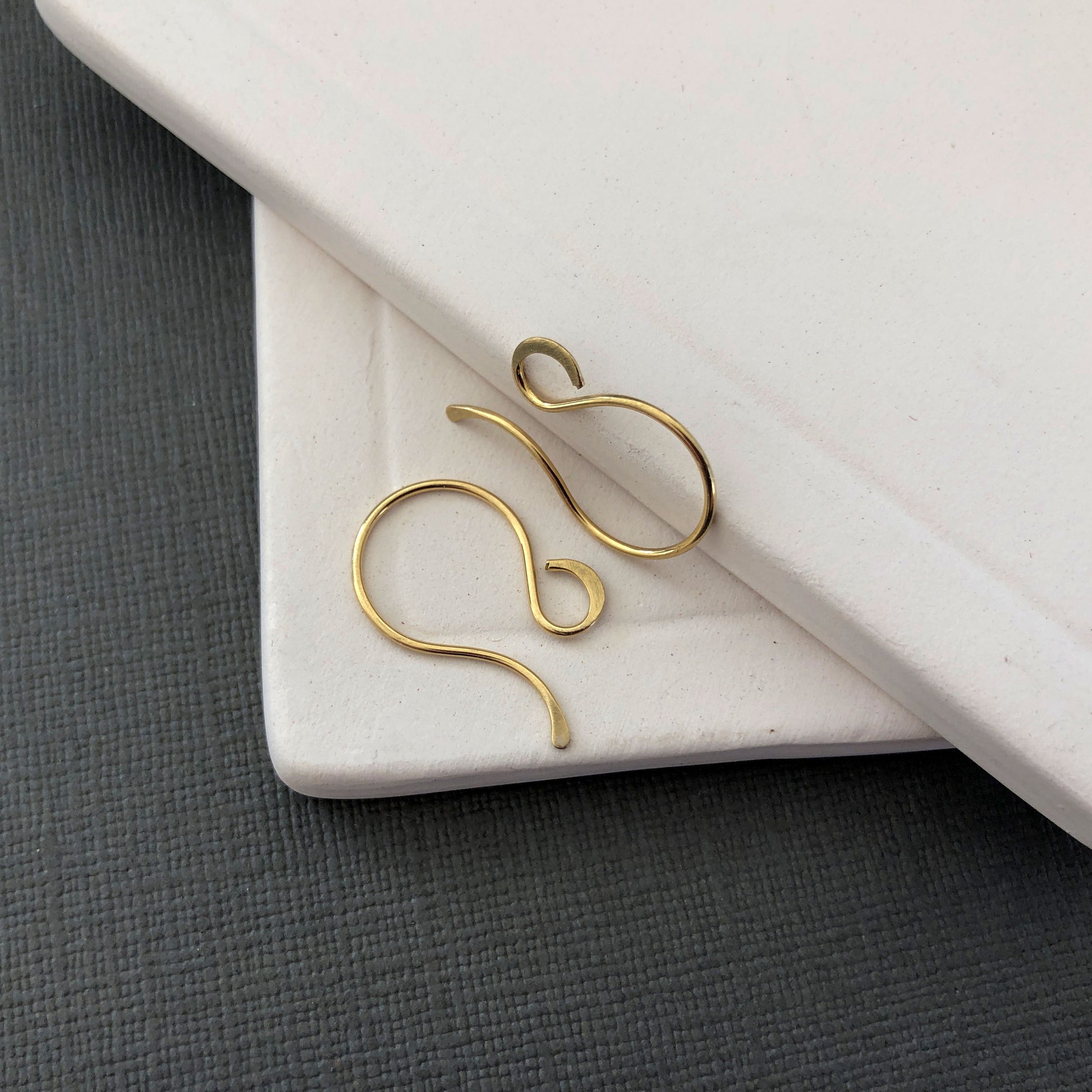 Detailed view of 18k gold ear wires for jewelry making