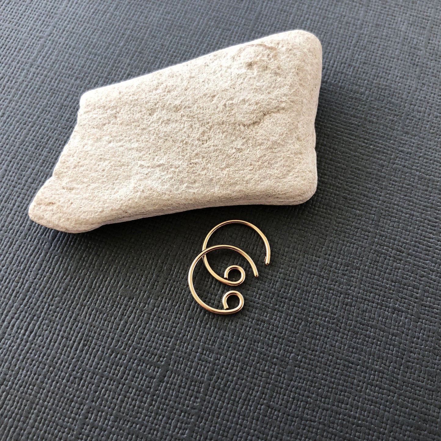 Side view of lightweight 14k gold filled tiny hoop earrings