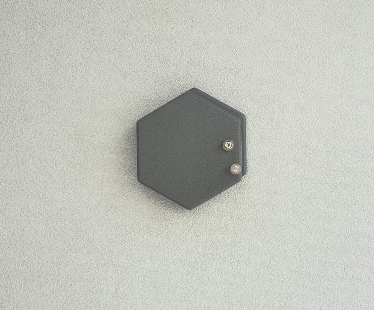 close-up view of solid 14K gold friction earring backs with clear silicone