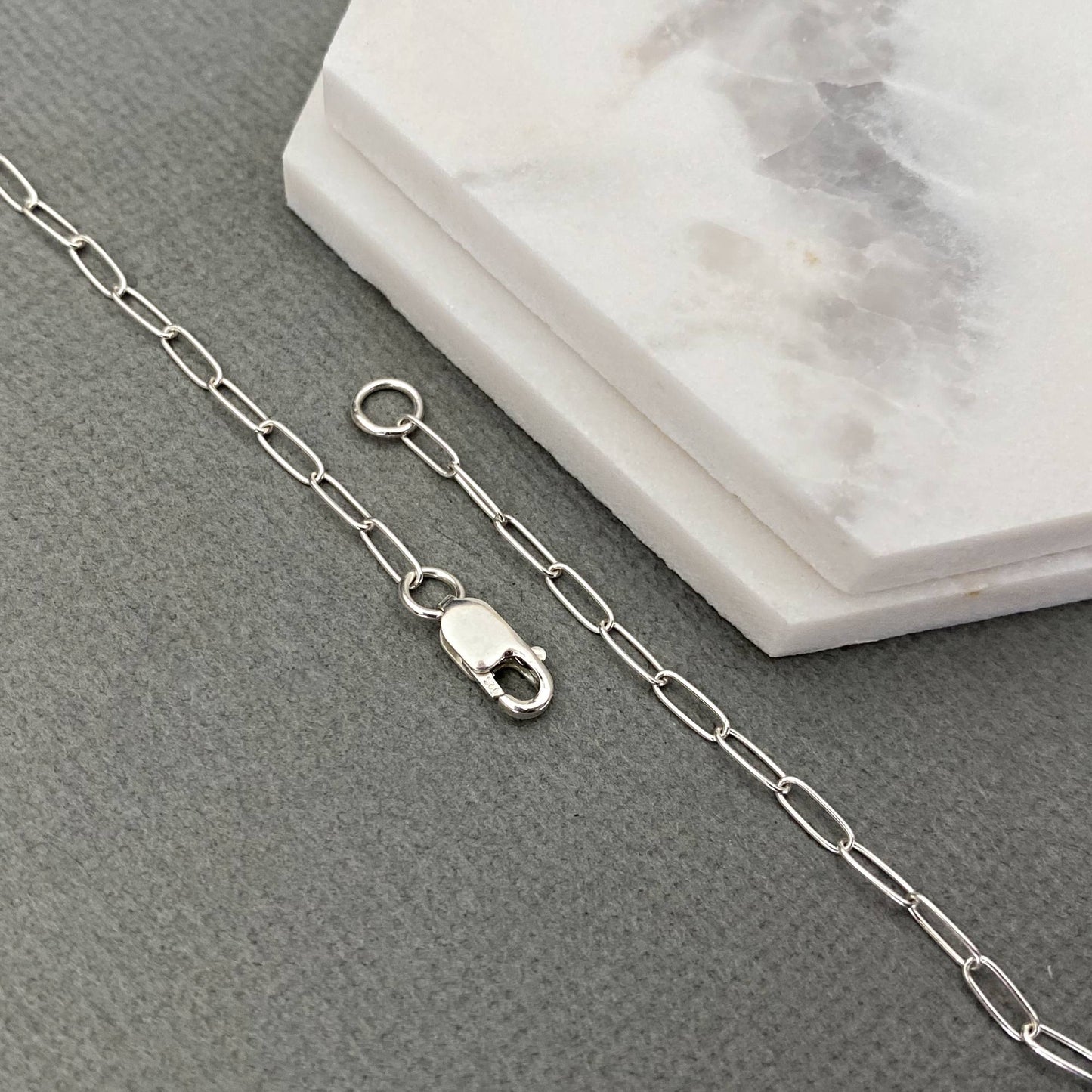 Solid 2mm sterling silver paperclip chain with adjustable links.