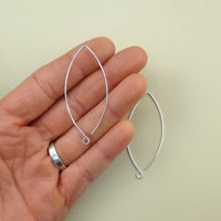 sterling silver earring hooks that are oblong or almond shape with a loop facing outward 2" long