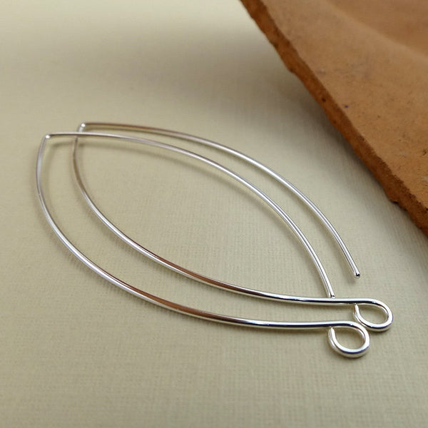 sterling silver earring hooks that are oblong or almond shape with a loop facing outward 2" long